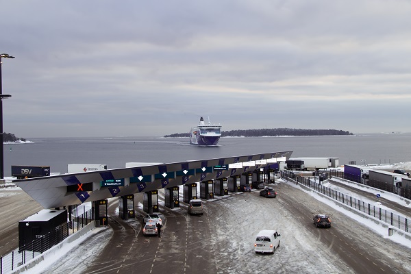 A ferry pulls into a snow covered port